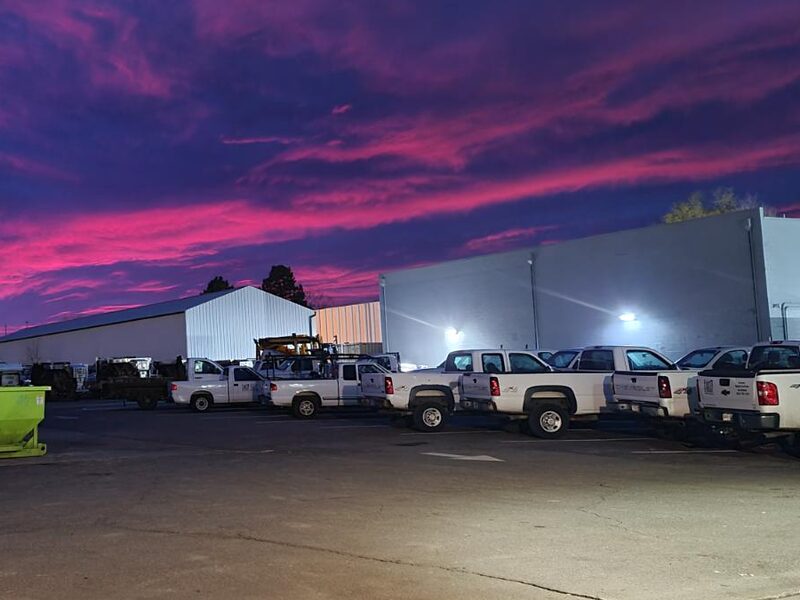 Row of S&K trucks in the Denver yard at dawn